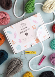 a craft diy box to make your own twine storage basket displayed with bundles of colourful twine