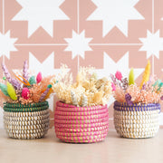 a trio of woven baskets from La Basketry with bundles of dried flowers from The Happy Blossoms