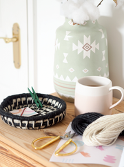 a black and white basket woven with la basketry twine basket kit to make at home