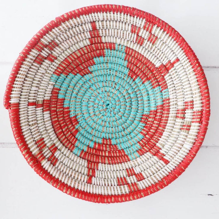 la basketry anta storage bowl in red white and turquoise with beautiful woven star pattern, handmade by artisans in senegal