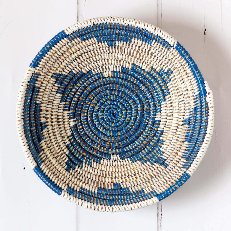 la basketry handwoven storage bowl in blue and white pattern shown from the top view showing the star like pattern of the weave